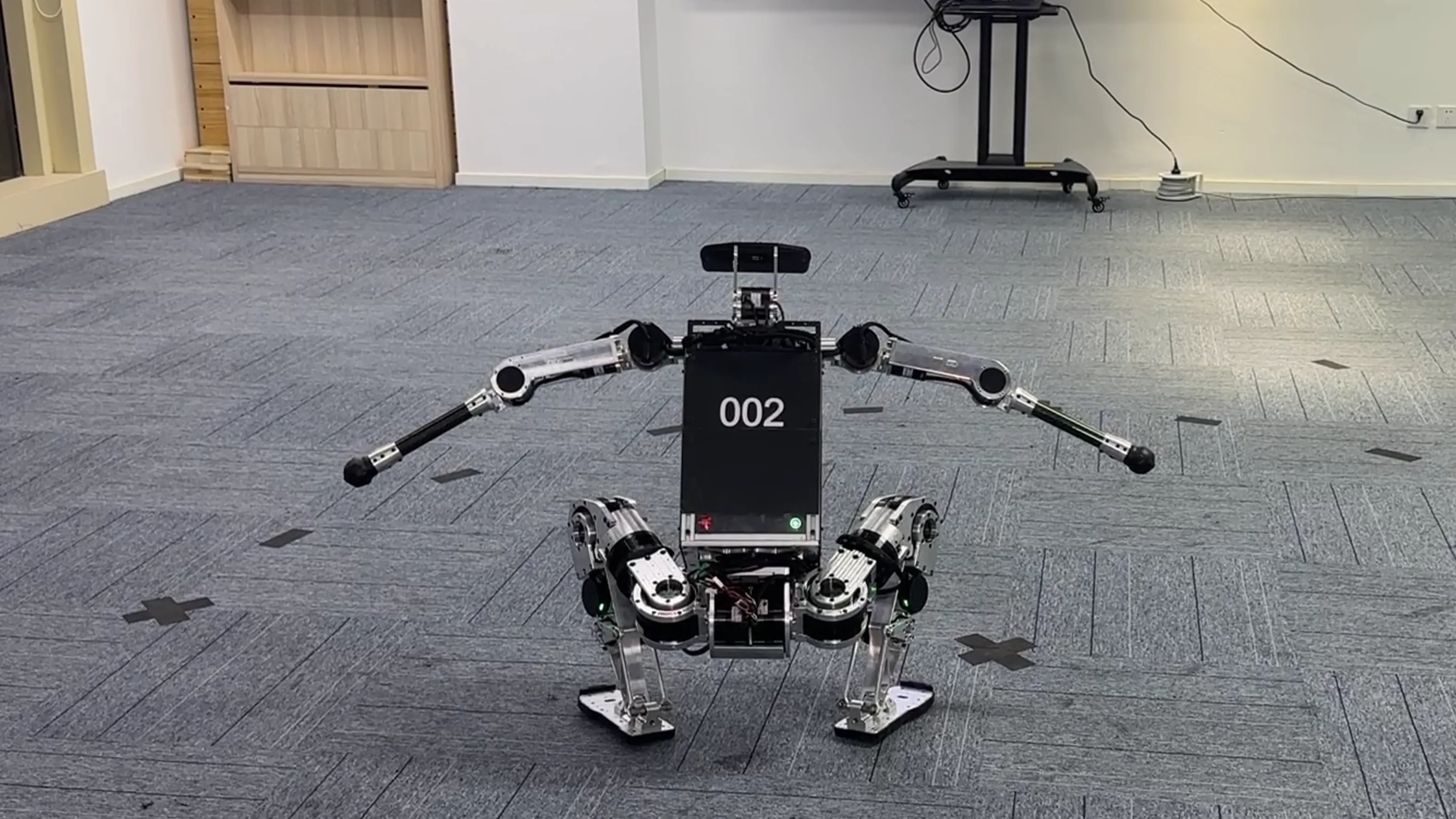 Booster Robotics BR002 performs spinning get-ups